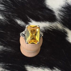 Brilliant yellow center stone ring